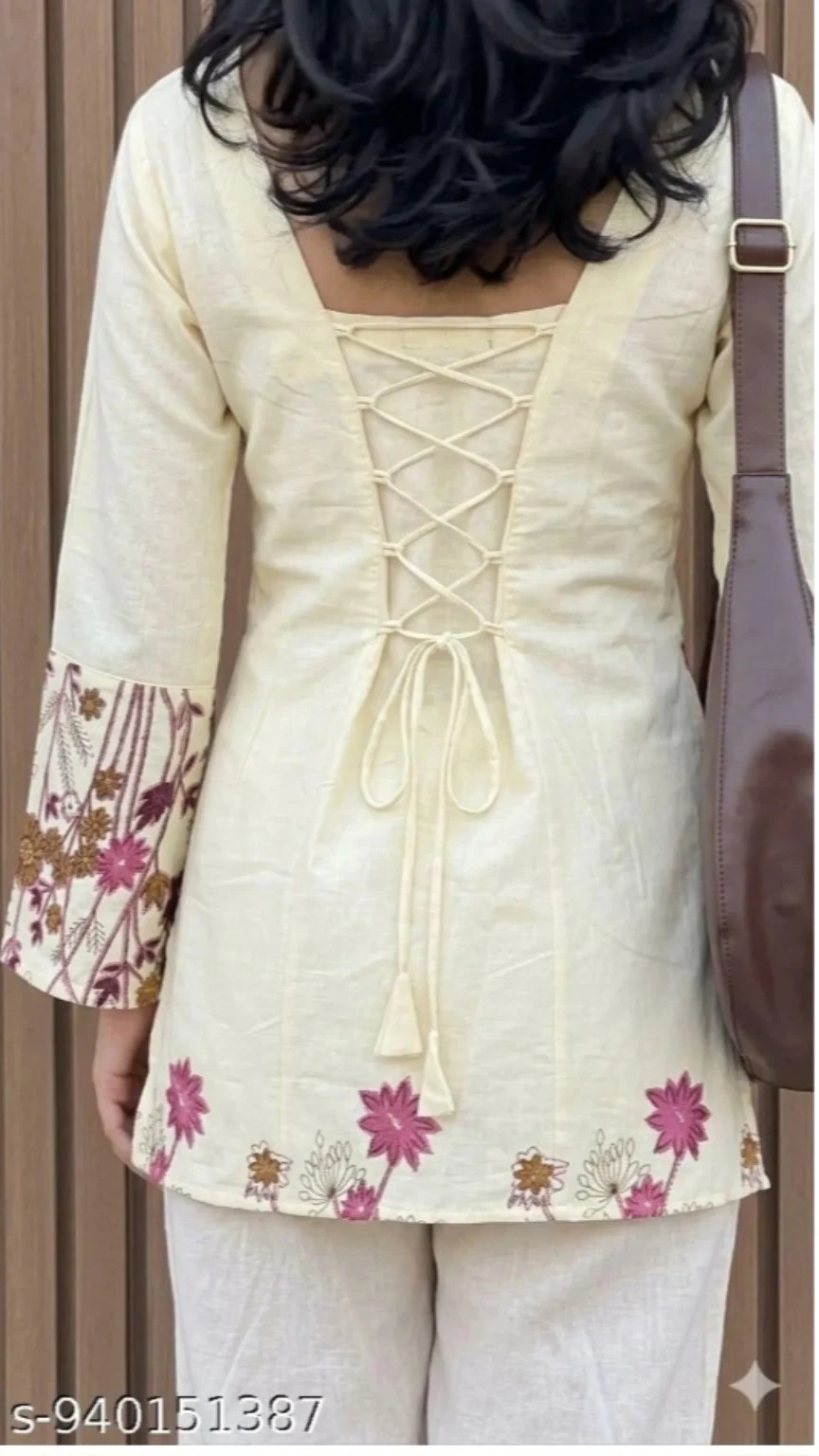 Lace-up tie detail at the back of the cream top